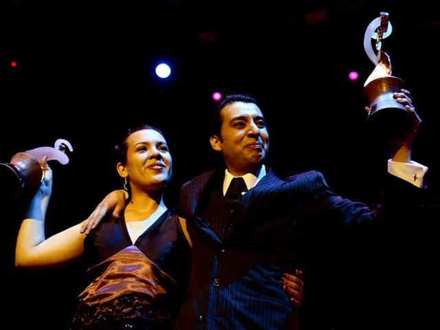 Argentina's Facundo Gomez Cross and Paola Palavecino Florence Sanz hold their trophies after winning the Tango Salon category at the Tango World Championship in Buenos Aires. AFP/Daniel Garcia