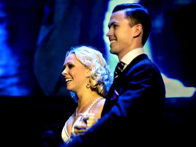 Russia's couple Dmitry Vasin and Taya Finenkova smile after knowing they occupied the fifth place in the Tango Salon category becoming the best positioned foreign couple at the World Championship of Tango Championship in Buenos Aires. AFP PHOTO/DANIEL GARCIA