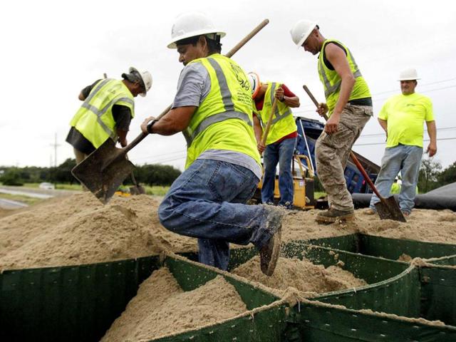 HESCO employees work at closing off Highway 23 South as hurricane Isaac heads towards the Louisiana coast line in Oakville, Louisiana. Reuters Photo HESCO employees work at closing off Highway 23 South as hurricane Isaac heads towards the Louisiana coast line in Oakville, Louisiana. Reuters Photo