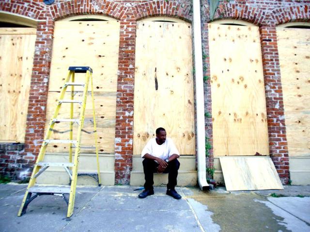James Cardoza takes a break after helping his boss board up his business in preparation for hurricane Isaac in New Orleans, Louisiana. Reuters Photo James Cardoza takes a break after helping his boss board up his business in preparation for hurricane Isaac in New Orleans, Louisiana. Reuters Photo