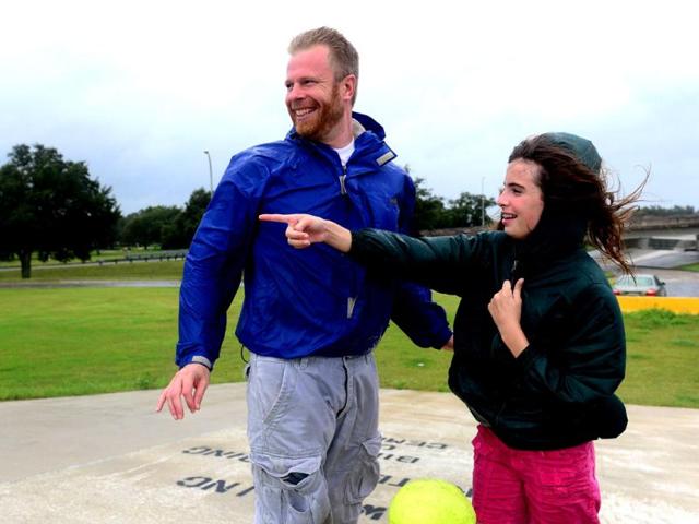 Emily Schneider and her father Scott brave rain and strong winds while visiting Lake Pontchartrain in New Orleans in Louisiana, where Hurricane Isaac has made landfall. The US National Hurricane Center said a "dangerous storm surge" was occurring along the northern Gulf Coast with storm surges of up to eight feet (2.4 meters) already being reported in Louisiana, Mississippi and Florida. States of emergency have been declared in Louisiana and Mississippi, allowing authorities to coordinate disaster relief and seek emergency federal funds. AFP PHOTO / Frederic J. BROWN