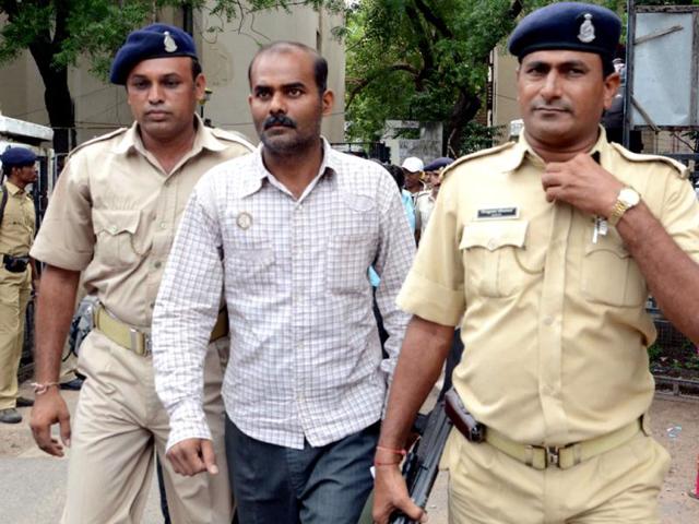 One of the convicts being taken to jail after a special court convicted 32 people in the Naroda-Patiya riots case in Ahmedabad. HT/Mayur Bhatt
