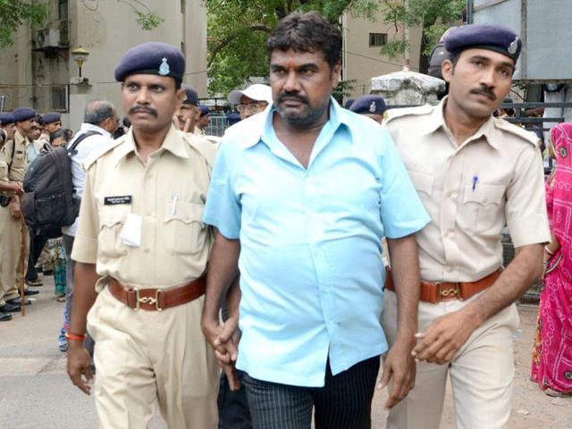 One of the convicts being taken to jail after a special court convicted 32 people in the Naroda-Patiya riots case in Ahmedabad. HT/Mayur Bhatt