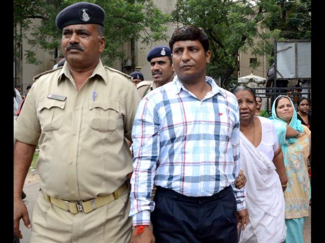 One of the convicts being taken to jail after a special court convicted 32 people in the Naroda-Patiya riots case in Ahmedabad. HT/Mayur Bhatt