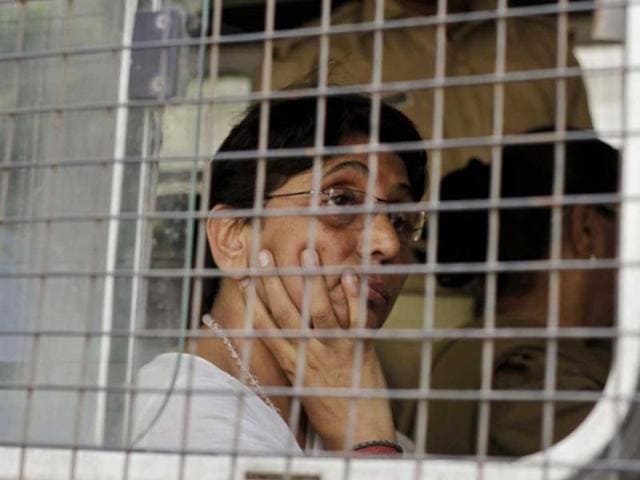 Former Gujarat minister and BJP leader Maya Kodnani arrives at a special court in Ahmedabad, in a police vehicle. AP Photo/Ajit Solanki