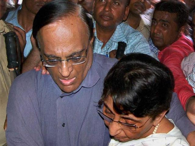 Former Gujarat minister Maya Kodnani, one of the convicts in Naroda Patiya massacre case, is consoled by her husband as she is brought to the court to hear the sentence in the case, in Ahmedabad. PTI Photo