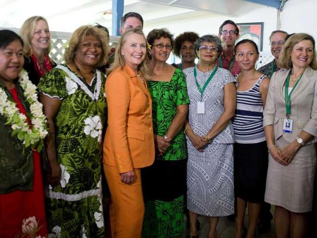 US secretary of state Hillary Clinton (C) poses with people who took part in the "Dialogue on Gender Equality" in Rarotonga. Reuters/Jim Watson/Pool