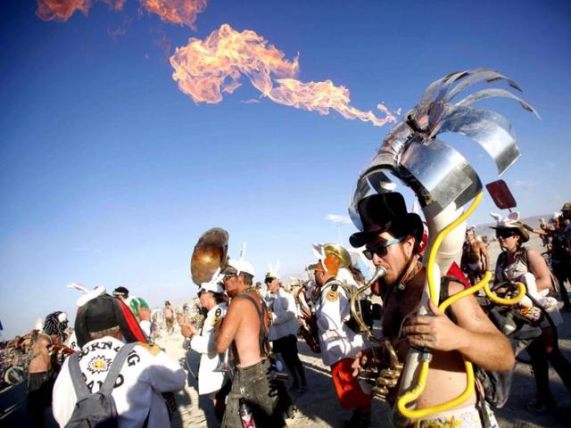 Yttri plays flaming tuba during Burning Man 2012 Fertility 2.0 arts and music festival in Black Rock Desert of Nevada. Reuters