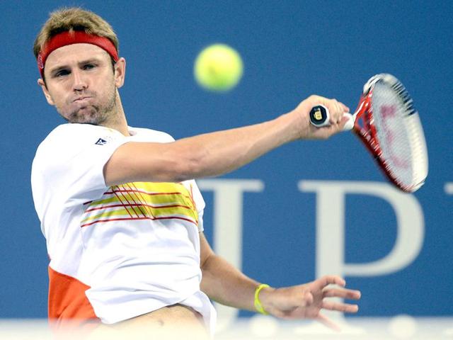 Mardy Fish returns a shot to Gilles Simon of France in the third round of play at the US Open tennis tournament in New York. AP Photo/Henny Ray Abrams