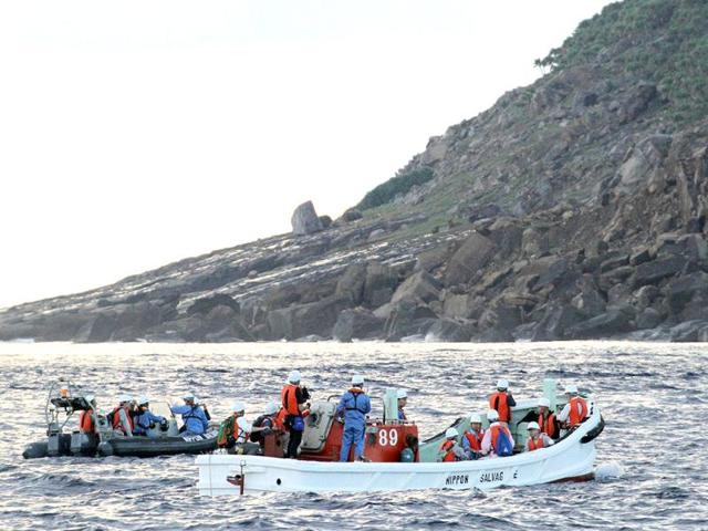 A team of Japanese surveyors conducts an offshore survey from boats near Uotsurijima island, part of the disputed island chain known in Japan as Senkaku and Diaoyu in China. AFP/Japan Pool via JIJI Press