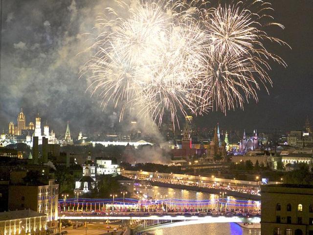 Fireworks explode over Red Square as military bands perform during the Spassky Tower festival in Red Square in Moscow, Russia. The Russian capital is celebrating its 865th birthday. AP Photo/Julia Tregub