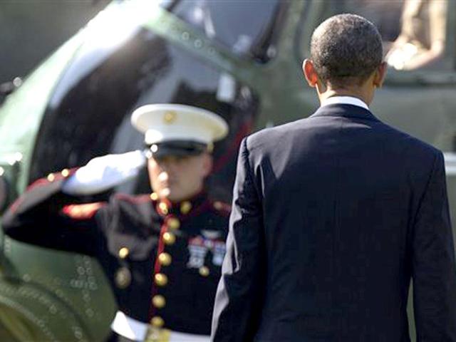US President Barack Obama walks from the White House in Washington to Marine One en route to El Paso, Texas. AP Photo/Carolyn Kaster