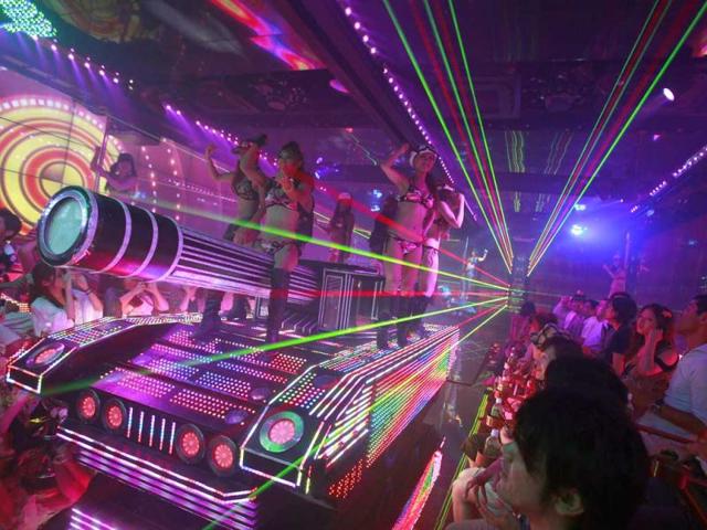 Bikini-clad women are seen on a mock tank decorated with lights, during a show at the newly opened Robot Restaurant in Kabukicho. Reuters Photo