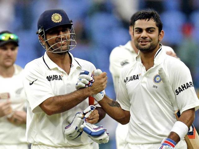 MS-Dhoni-and-Virat-Kohli-celebrating-after-India-won-the-match-and-the-series-against-New-Zealand-on-the-fourth-day-of-their-second-test-cricket-match-in-Bangalore-Photo-by-Gurpreet-Singh-Hindustan-Times