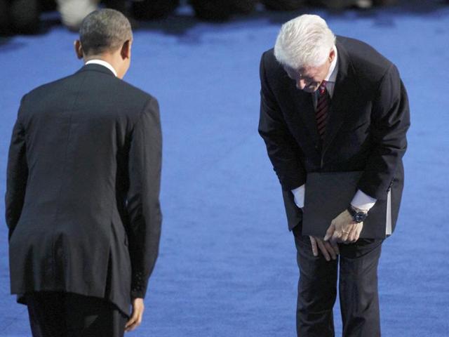 Former President Bill Clinton bows to President Barack Obama after Clinton nominated Obama for re-election during the second session of the Democratic National Convention in Charlotte, North Carolina. Reuters/Jonathan Ernst