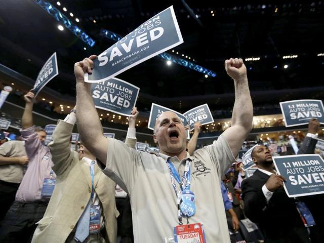 Delegates cheer as former President Bill Clinton arrives to address the Democratic National Convention in Charlotte, North Carolina. AP/David Goldman