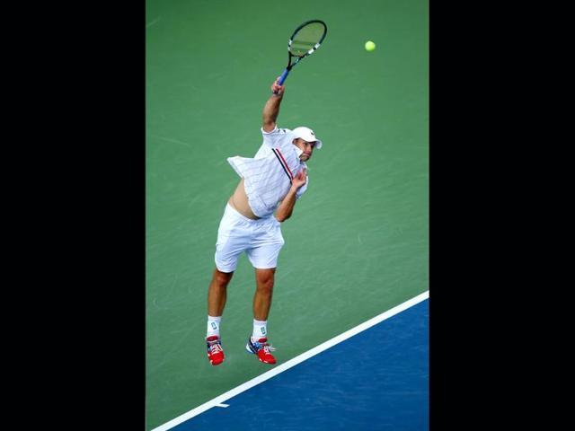 Andy Roddick of the United States serves against Juan Martin Del Potro of Argentina during their men's singles fourth round match on Day Ten of the 2012 US Open at USTA Billie Jean King National Tennis Center. Elsa/Getty Images/AFP