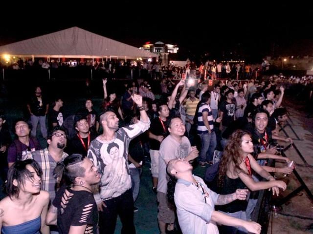 The crowd looks spellbound as they swing along during the concert.