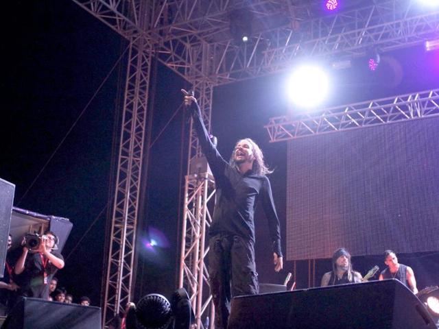 Korn lead singer Jonathan Davis waves to the audience during their first ever concert in India.