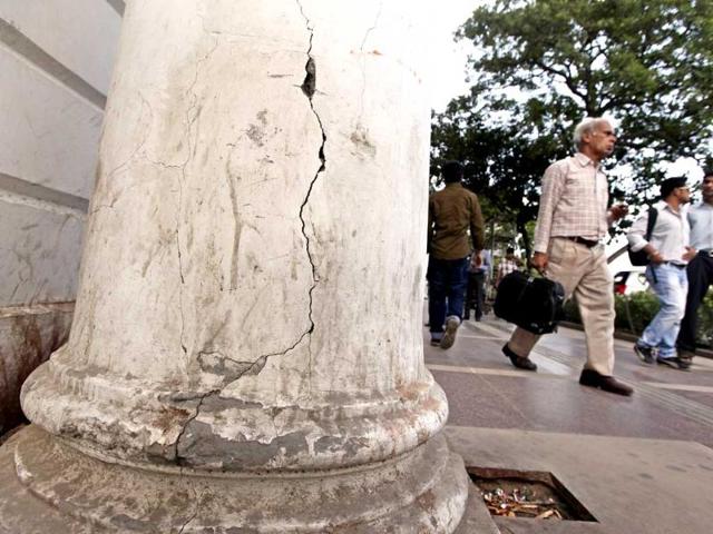 Cracks are visible on a pillar in Block-A, Connaught Place. The project to take the British era market back to its glory days has missed every deadline. HT Photo/Raj K Raj