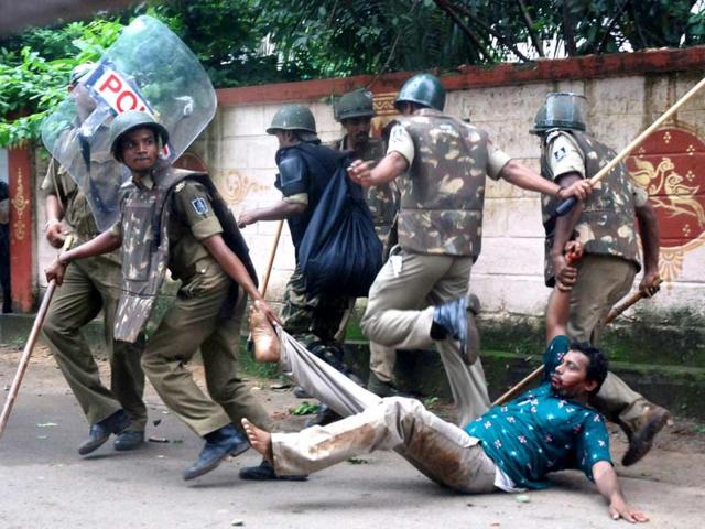 A demonstrator is taken away by policemen during a violent protest in Bhubaneswar. (AFP photo)