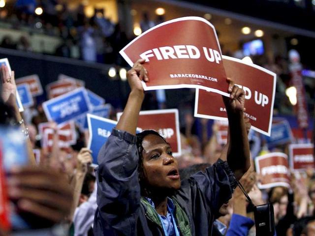 Delegates hold a signs during the final session of the Democratic National Convention in Charlotte, North Carolina. Reuters/Jessica Rinaldi