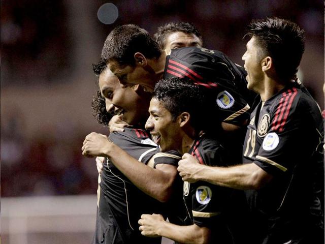 Jesus Zavala of Mexico celebrates with team-mates after scoring a goal against Costa Rica during their World Cup qualifying soccer match at the National Stadium in San Jose. Reuters/Juan Carlos Ulate