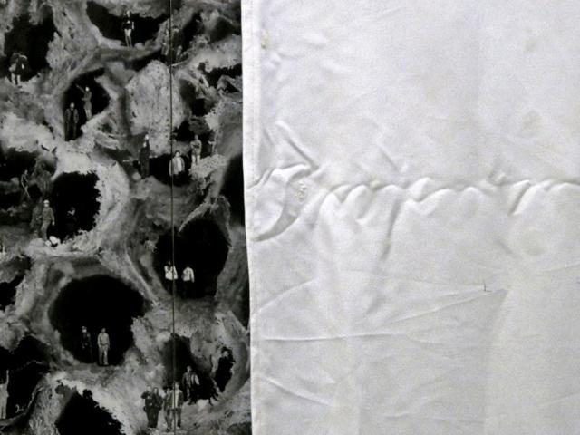 An art piece deemed unfit for display by members of the cultural bureau is seen half covered prior the inauguration of the SH Contemporary Art Fair at the Shanghai Exhibition Center. Reuters/Stringer