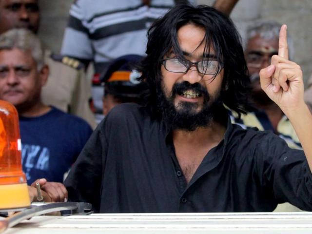 Kanpur-based-cartoonist-Aseem-Trivedi-who-was-arrested-on-charges-of-posting-seditious-contents-on-his-website-is-seen-outside-a-Mumbai-court-PTI