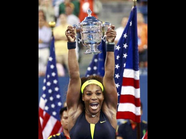 Serena Williams of the US celebrates with her trophy after defeating Victoria Azarenka of Belarus in their women's singles finals match at the US Open tennis tournament in New York. REUTERS