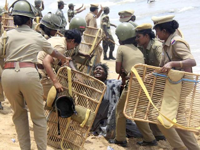 Police detain a demonstrator during a protest near a nuclear power project in Kudankulam in Tamil Nadu. Reuters Photo