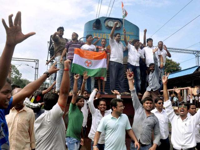 Congress workers stop a train at Bhubaneswar railway station during their 12 hours Odisha Bandh against the alleged police atrocity on them during their rally. PTI