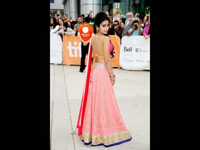 Actor Shriya Saran brings sexy back during the 37th Toronto International Film Festival. She was a delight for the cameras in a glamourous pink lehanga-choli and her playful demeanour.