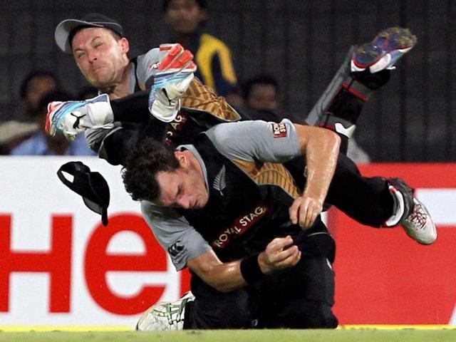 Brendon McCullum and Kyle Mills clash while trying to take a catch during the T20 match against India at MAC Stadium in Chennai. PTI/R Senthil Kumar