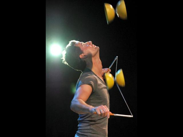 A performer of the world famous trouple Cirque du Soleil practices his juggling routine in the big top tent in Sydney. Cirque du Soleil takes the audience into the diverse and colorful world of insects in their show that made its debut in Montreal. (AFP Photo)