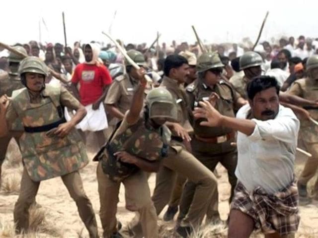 Tamil Nadu chief minister J Jayalalithaa had justified the police action. She also announced compensation of Rs.5 lakh to the kin of the protester killed. In this picture, police charge activists of People's Movement Against Nuclear Energy (PMANE) during a protest near Kudankulam Nuclear Power Project (KNPP) in Tirunelveli. PM Manmohan Singh blamed foreign based NGOs for fuelling and funding protests at the power plant. (PTI Photo)