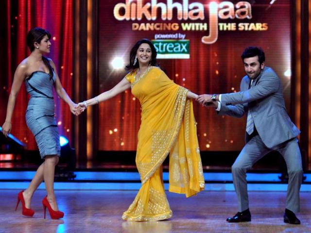 Tug of war: Priyanka Chopra and Ranbir Kapoor pull Madhuri Dixit on their respective sides. (Photo: AFP)