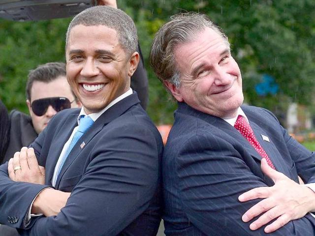 US Presidential candidate Mitt Romney impersonator Mike Cote and US President Barack Obama impersonator Reggie Brown perform a dance face off during an Obama vs Romney 'showdown' in Washington Square Park in New York. (AFP Photo)