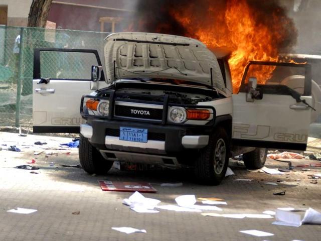 A vehicle burns at the US embassy in Sanaa. Reuters/Mohamed al-Sayaghi