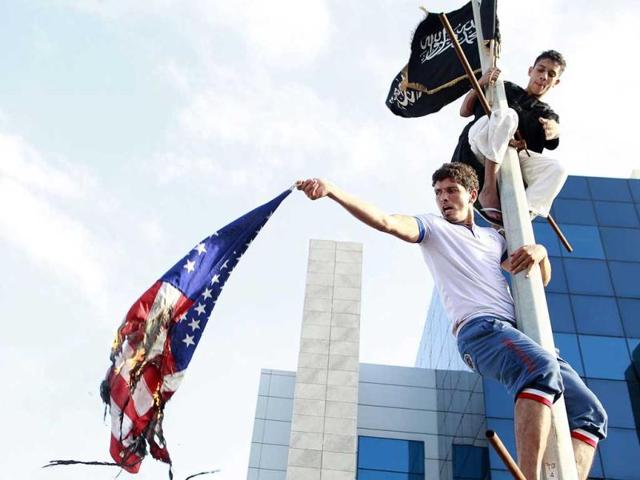 Arab-Israeli Muslim men protest in front of the US embassy in the Mediterranean coastal city of Tel Aviv against a film mocking Islam. AFP/Jack Guez