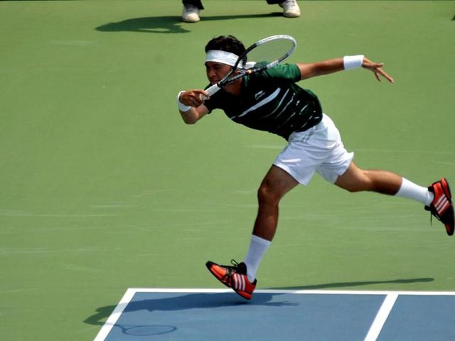 Christopher Benjamin Rungkat of Indonesia returns a shot during the final round of the men's singles Davis Cup Asia-Oceania Zone group II final match against Francis Casey Alcantara of the Philippines at Gelora Bung Karno Tennis Stadium in Jakarta on September 14, 2012. AFP Photo