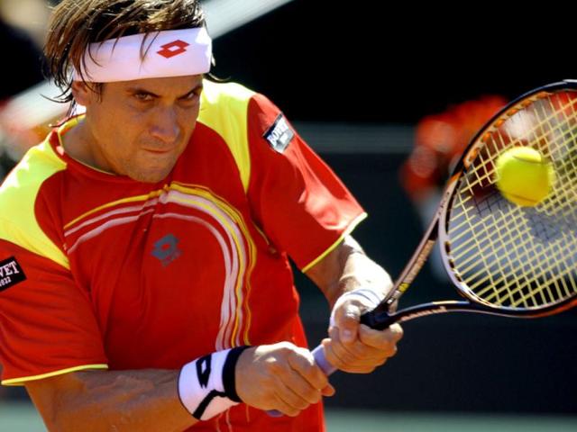 Spain's David Ferrer returns a ball against US Sam Querrey during the first match of the Davis Cup semi-final Spain vs USA at the Hermanos Castro park court in Gijon, northern Spain, on September 14, 2012. AFP Photo