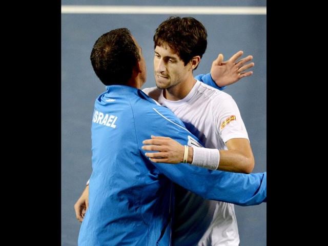 Amir Weintraub (R) of Israel is congratulated by team captain Eyal Ran (L) after his victory against Tatsuma Ito of Japan during the Davis Cup World Group tennis play-off in Tokyo on September 14, 2012. Weintraub defeated Ito 6-3, 6-2, 6-4. AFP Photo