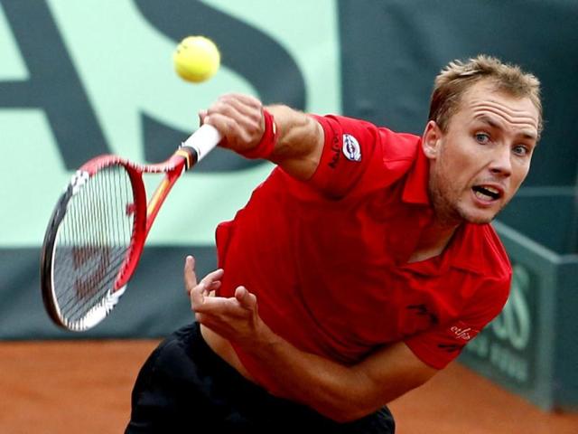 Steve Darcis of Belgium serves to Michael Ryderstedt of Sweden during their Davis Cup World Group play-off tennis match in Brussels September 14, 2012. Reuters
