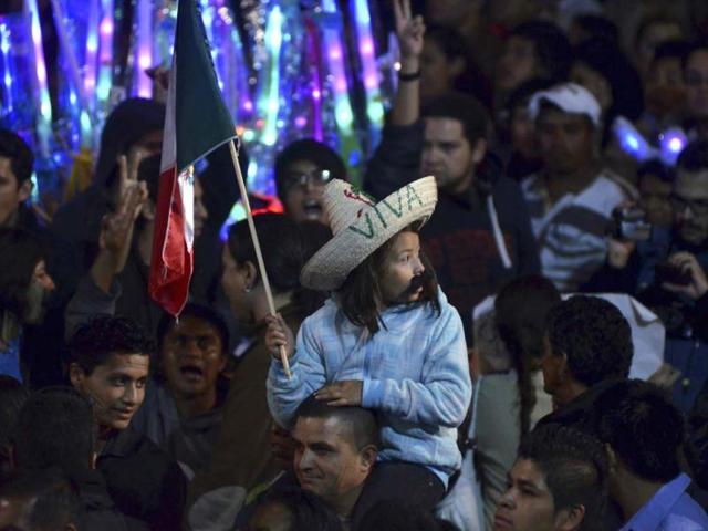 People gather to celebrate the 202nd anniversary of their independence from Spain at Zocalo square in downtown Mexico City. Reuters/Alan Ortega