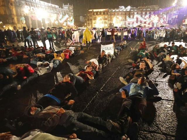 Protesters demonstrate against Mexican President Felipe Calderon and Mexico's President-elect Enrique Pena Nieto, as other Mexicans celebrate the 202nd anniversary of their independence from Spain, at the Zocalo square in downtown Mexico City. Reuters/Bernardo Montoya