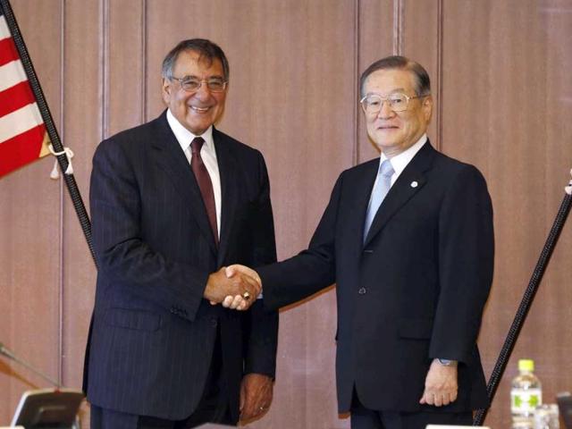 US Secretary of Defense Leon Panetta (L) shakes hands with Japan's Minister of Defense Satoshi Morimoto at the Ministry of Defense in Tokyo. Reuters photo