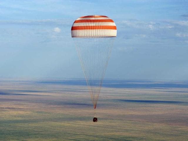 In this photo provided by NASA, the Soyuz TMA-04M spacecraft lands with Expedition 32 Commander Gennady Padalka of Russia, NASA Flight Engineer Joe Acaba and Russian Flight Engineer Sergie Revin in a remote area near the town of Arkalyk, Kazakhstan. Padalka, Acaba and Revin returned from five months onboard the International Space Station where they served as members of the Expedition 31 and 32 crews. AP photo