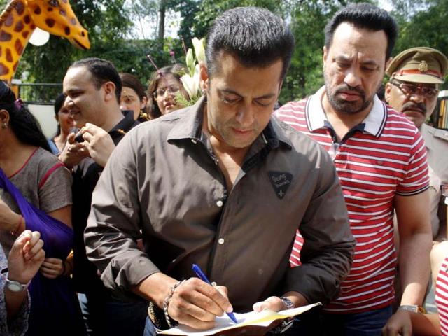 Salman Khan signs autographs.