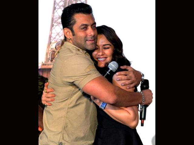 Bollywood actor Salman Khan hugs Preity Zinta during the music launch of their upcoming Hindi film Ishkq in Paris in Mumbai on September 17. (PTI Photo)